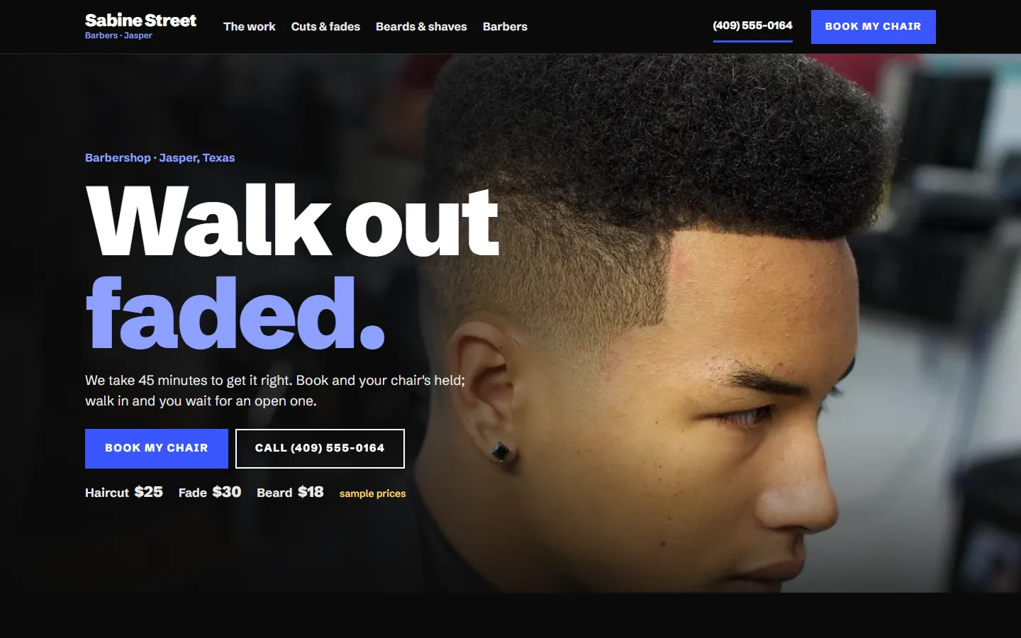 Sample barbers website on a computer
